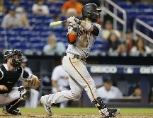 Brandon Crawford estuvo acertado con el madero y le dio la victoria a los Gigantes. AFP/M. Reaves
