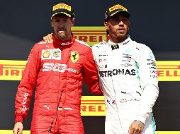 Los comisarios de la carrera dieron al alemán una penalización de cinco segundos por un reingreso peligroso de Vettel. AFP / M. Thompson