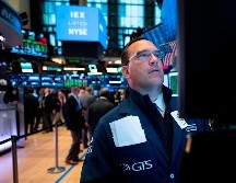El Dow Jones ganó 353 unidades, 1.4 por ciento, hasta 26 mil 465 puntos. AFP/J. Eisele