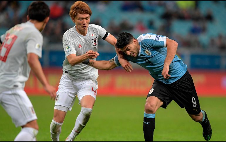 Con el empate Uruguay suma 4 puntos mientras que Japón suma su primera unidad en el grupo C. AFP / C. de Souza