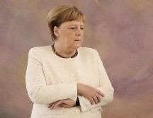 Angela Merkel presentó el temblor en la ceremonia de traspaso de poderes de las ministras de Justicia en el Palacio Bellevue en Berlín. AFP/dpa/K. Nietfeld