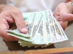 La moneda se compró en un mínimo de 18.37 pesos. EL INFORMADOR/ARCHIVO