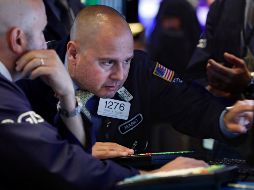 El NYSE Composite se muestra con un retroceso de 14.14 puntos, para operar en 13 mil 219.25 unidades. AP / R. Drew