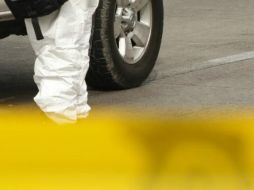 En la escena, peritos criminalistas recolectaron indicios balísticos y otros elementos que forman parte de la investigación. EL INFORMDOR / ARCHIVO