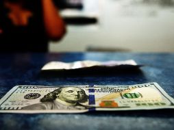 La moneda se compró en un precio mínimo 18.90 pesos en bancos capitalinos. EL INFORMADOR/ARCHIVO