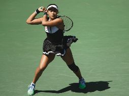 La tenista nipona continúa con su buena racha en el US Open, aunque en esta ocasión se quejó por las altas temperaturas. AFP