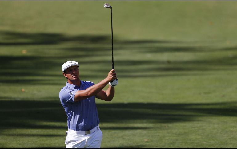 El estadounidense Bryson DeChambeau tomó el primer lugar tras una ronda de 64 golpes, 8 bajo par. AFP/J. Ferrey