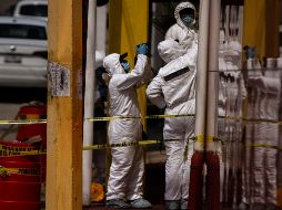 Peritos criminalistas arribaron al lugar para realizar las primeras investigaciones en la zona. NTX/ARCHIVO