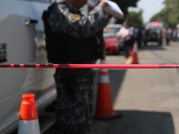 Elementos de la Guardia Nacional, el Ejército y la Policía de Michoacán resguardan la zona tras el ataque. EL INFORMADOR/ARCHIVO