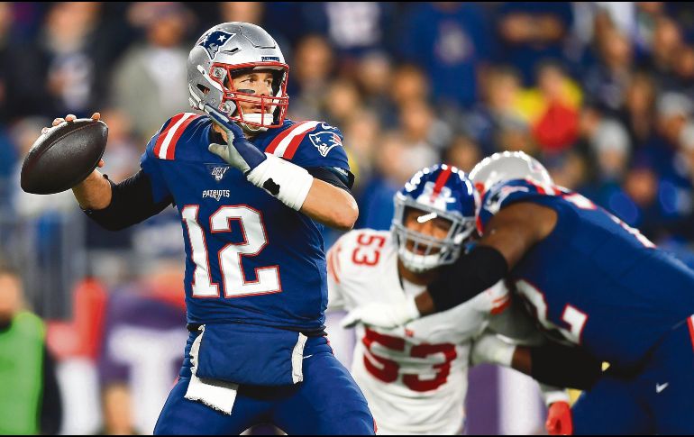 Tom Brady. El quarterback de Nueva Inglaterra colaboró con dos touchdowns en seis acarreos para la victoria de su equipo. AFP