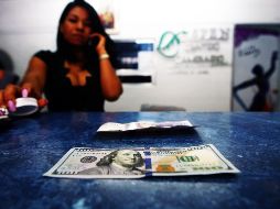 Este miércoles, el billete verde se compró en un mínimo de 18.47 pesos. EL INFORMADOR/ARCHIVO