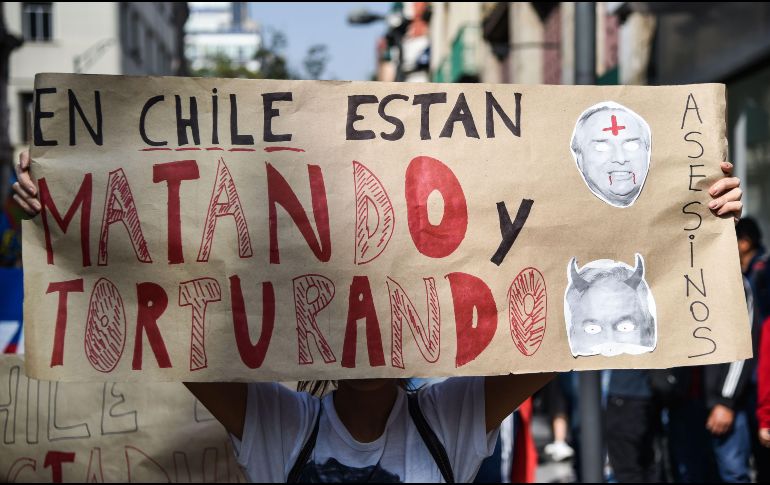Dieciocho personas han muerto en Chile, algunas de ellas a manos de militares. AFP/R. Arangua