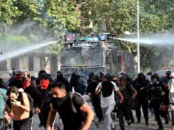 En el centro de Santiago, se percibió justo cuando la policía dispersaba a miles de personas que se manifestaban para pedir reformas sociales y contra el gobierno de Sebastián Piñera. AFP/ M. Bernetti