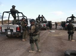 Elementos de seguridad montan guardia en el retén de una carretera en el poblado de Janos, estado de Chihuahua. NTX/C. Chávez