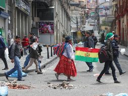 Ciudadanos salieron a las calles de Bolivia luego que Evo Morales se declarara victorioso en los últimos comicios. EFE / M. Alipaz