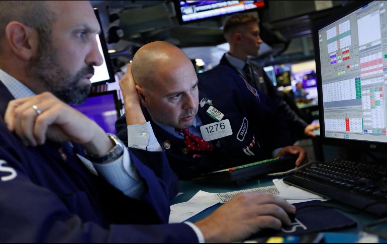 El índice Dow Jones abrió operaciones con un alza de 49.11 puntos. AP / R. Drew