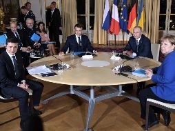 Putin y Zelenski estuvieron en compañía de Emmanuel Macron, presidente de Francia, y Angela Merkel, canciller de Alemania. AFP/Presidencia de Ucrania