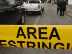 Peritos de la Fiscalía llegaron al lugar para trasladar los cuerpos al forense y realizar las investigaciones de rigor. EL INFORMADOR/ARCHIVO