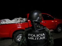 Cuerpos de reos fallecidos en la cárcel en El Porvenir llegan a la morgue en Tegucigalpa. AFP