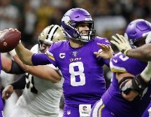 Cousins se conectó con Kyle Rudolph para sellar el triunfo de los Vikingos. AFP / K. Cox