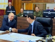 Putin y Asad en una reunión en Damasco este martes. Es la primera visita del mandatario ruso a la capital siria en nueve años de guerra. AP/Presidencia siria
