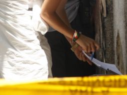 Llegaron al lugar representantes del Ministerio Público del área de Homicidios, así como peritos forenses. EL INFORMADOR / ARCHIVO