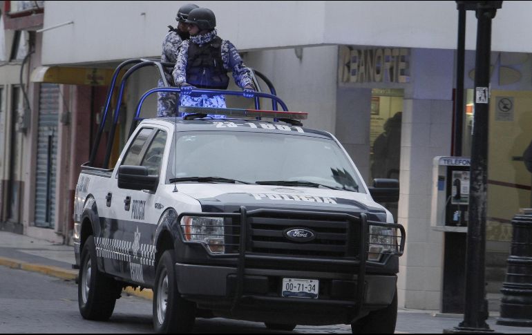 Además de la detención de los sospechosos, policías aseguraron armas y un vehículo con reporte de robo. AFP/ARCHIVO