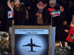 Dolientes en una ceremonia para recordar a los fallecidos en el incidente del 8 de enero. AP/J. Hayward