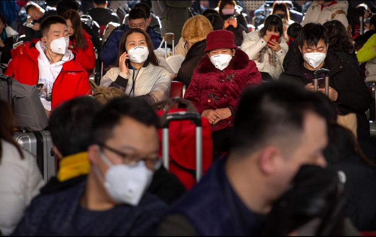 Autoridades chinas y la OMS han recomendado el uso de mascarillas como medida para prevenir la infección. AP/M. Schiefelbein