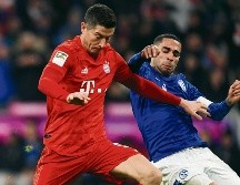 Lewandowski. El atacante polaco (izq.) encabeza la tabla de los mejores goleadores del torneo.  AFP