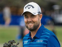 Campeón. El golfista australiano consiguió el quinto título de su carrera gracias a una ronda de 65 golpes. AFP / S. Haffey