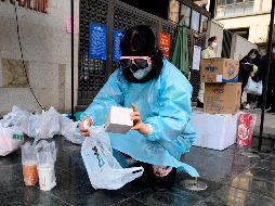 Como en otras ciudades chinas, las personas encerradas en complejos de vivienda podrán seguir recibiendo pedidos de comida y otros artículos. AFP/ARCHIVO