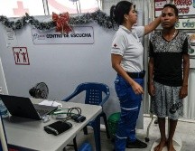 La llegada de miles de venezolanos ha mejorado la vida de miles de colombianos que se han beneficiado indirectamente de la ayuda humanitaria. AFP