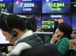 Expertos no logran evaluar el impacto del coronavirus sobre las ganancias de las empresas. AP/A. Young-joon