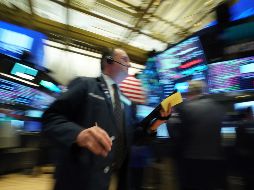 La creciente crisis del coronavirus provocó el jueves por la mañana una suspensión temporal automática breve en las operaciones matutinas en las bolsas de EU. AFP/B. Smith