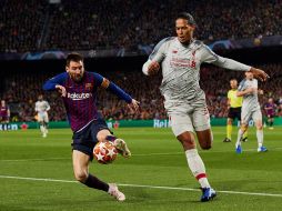 El defensa holandés y Messi se vieron las caras en la pasada edición de la Champions League en donde el Liverpool echó al Barcelona en una eliminatoria histórica. ESPECIAL
