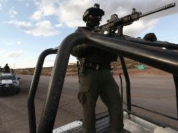 Autoridades decomisaron en el lugar dos granadas, dos vehículos y 18 armas largas. AP/ARCHIVO