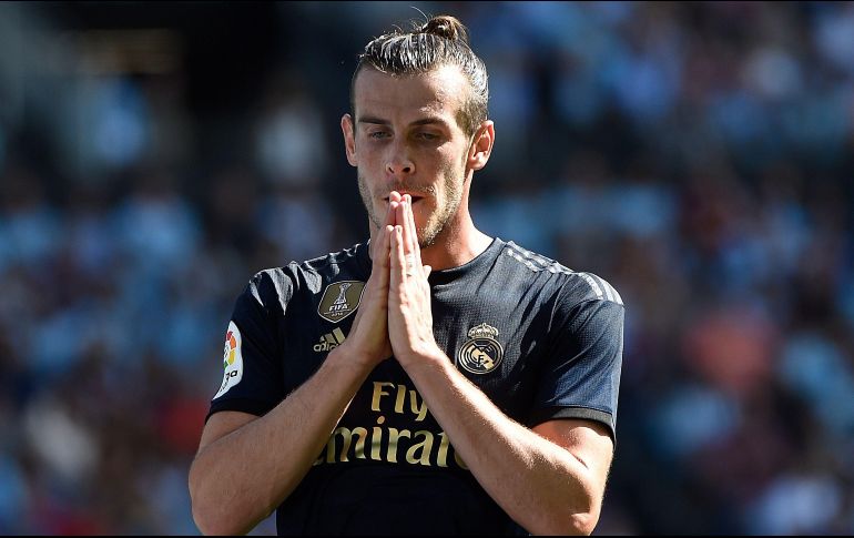 Bale dice que en España ''es bastante estricto, no se puede salir a casi nada, ni hacer deporte, pero lo entendemos, sin sacrificios necesarios''. AFP / ARCHIVO