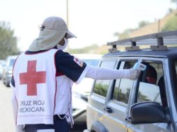 En la toma de temperatura participa personal de la Cruz Roja, Protección Civil y Bomberos de Jalisco, la Guardia Nacional, entre otras dependencias. ESPECIAL/ Gobierno de Jalisco