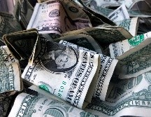 Autoridades han determinado adónde estaba dirigido el dinero, pero siguen tratando de esclarecer cómo fue a parar sobre una carretera. AP/ARCHIVO