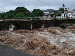 El acumulado de lluvia provocó el colapso de una vivienda en la comunidad Sexan. AFP / J. Ordonez