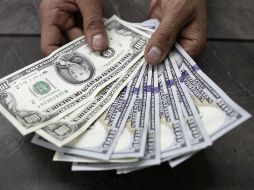 En ventanillas bancarias el dólar se vende esta mañana al menudeo entre 21.61 y 22.46 pesos. EL INFORMADOR/ARCHIVO