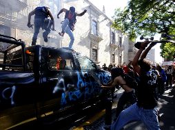 Actos vandálicos durante la protesta del 4 de junio afuera de Palacio de Gobierno. El partido pide comprobar si la identidad de los detenidos corresponde a personas fuera del estado. AFP/ARCHIVO