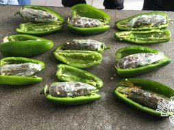 El ''alimento'' sería entregado por un familiar a uno de los internos. ESPECIAL / Secretaría de Seguridad Pública de Puebla