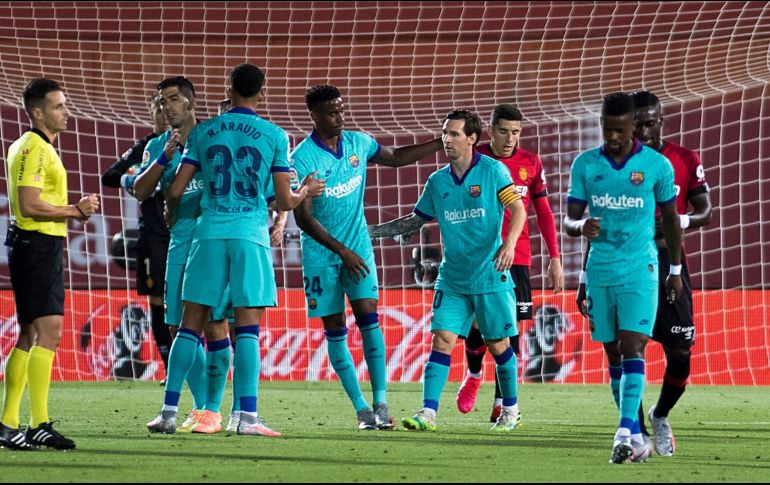 El Barcelona goleó 4-0 en el campo del Mallorca (18) este sábado en su regreso a la competición tras la pandemia en la 28ª jornada liguera. AFP / J. Reina