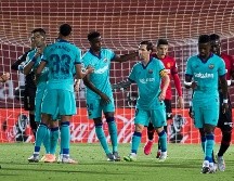 El Barcelona goleó 4-0 en el campo del Mallorca (18) este sábado en su regreso a la competición tras la pandemia en la 28ª jornada liguera. AFP / J. Reina