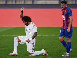 SOLIDARIO. Marcelo mostró su apoyo a las protestas contra la desigualdad racial tras marcar el tercer gol madridista. AFP / P. MARCOU