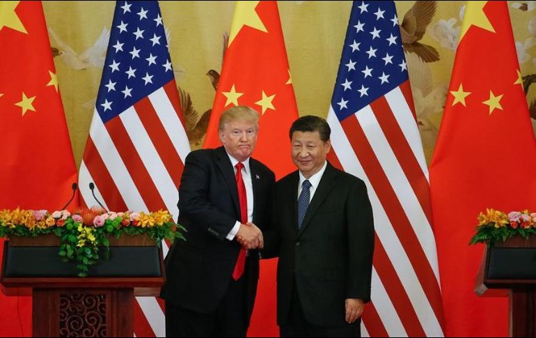 El extracto narra el encuentro entre Trump y Xi en junio de 2019 durante la cumbre del G-20 en Osaka. EFE/R. Pilipey