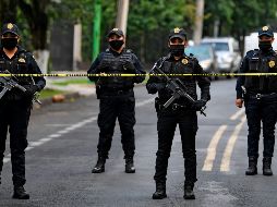 Oficiales de policías aseguran el área luego del ataque contra Omar García Harfuch, titular de la Secretaría de Seguridad Ciudadana de la Ciudad de México. AFP / P. Pardo