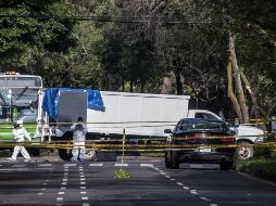 Hombres armados atravesaron un camión para bloquear el paso de la camioneta en la que viajaba García Harfuch y desde ahí abrieron fuego. SUN/G. Espinosa